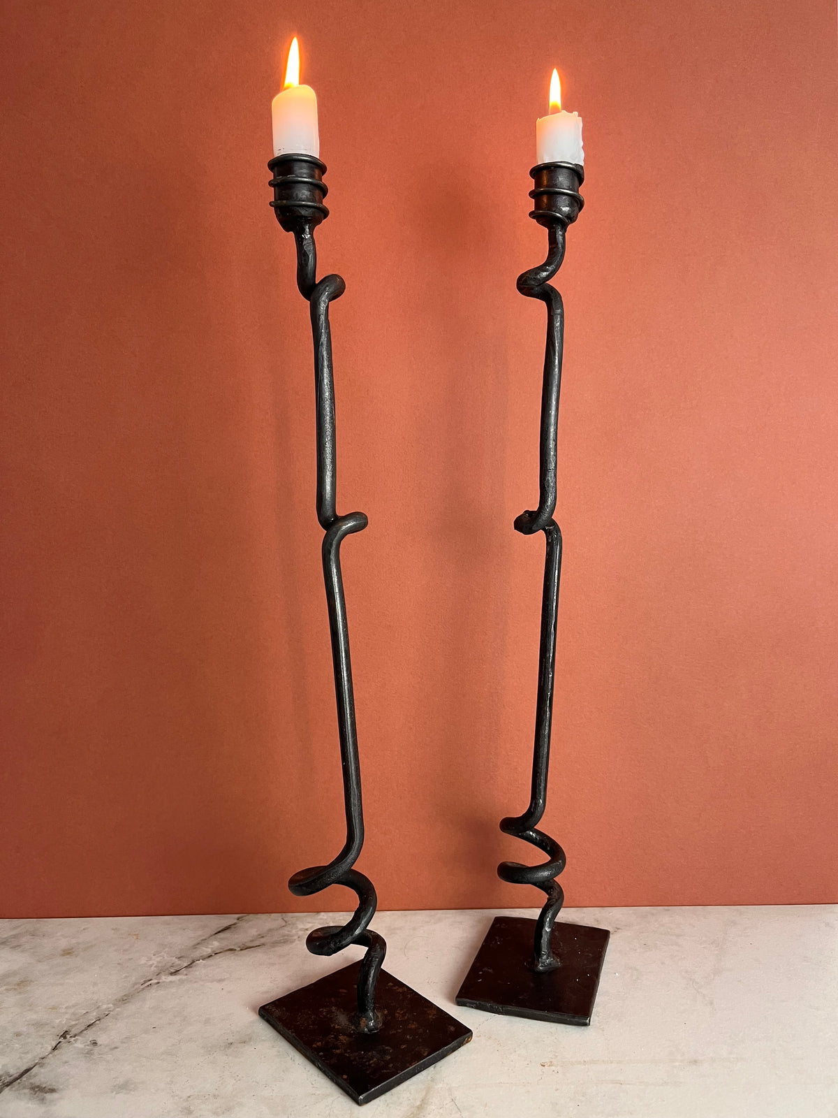 A PAIR OF TWISTED CANDLE HOLDERS