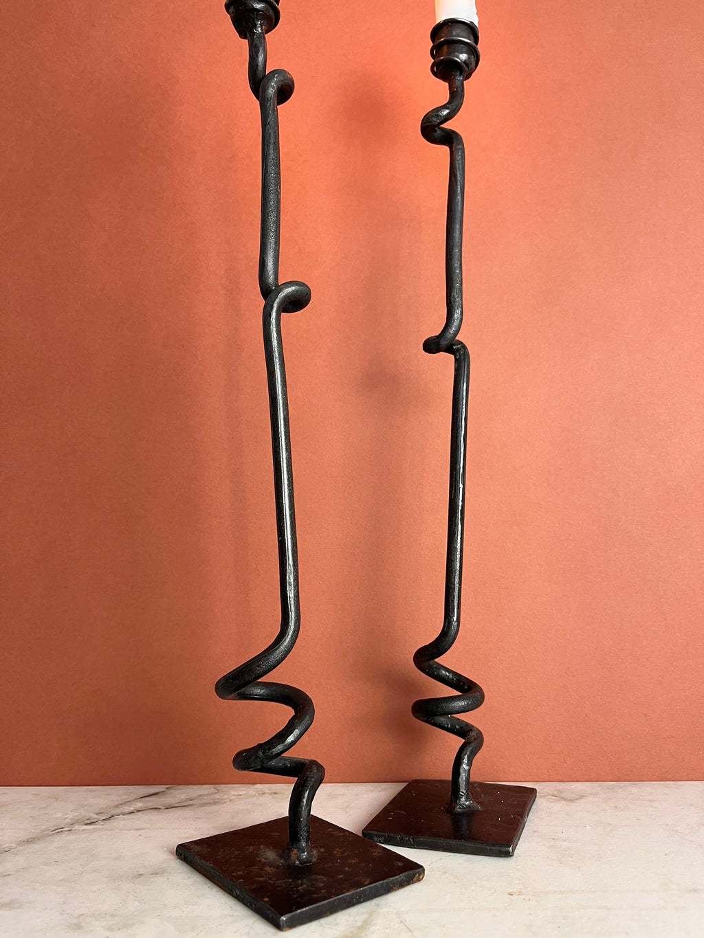 A PAIR OF TWISTED CANDLE HOLDERS