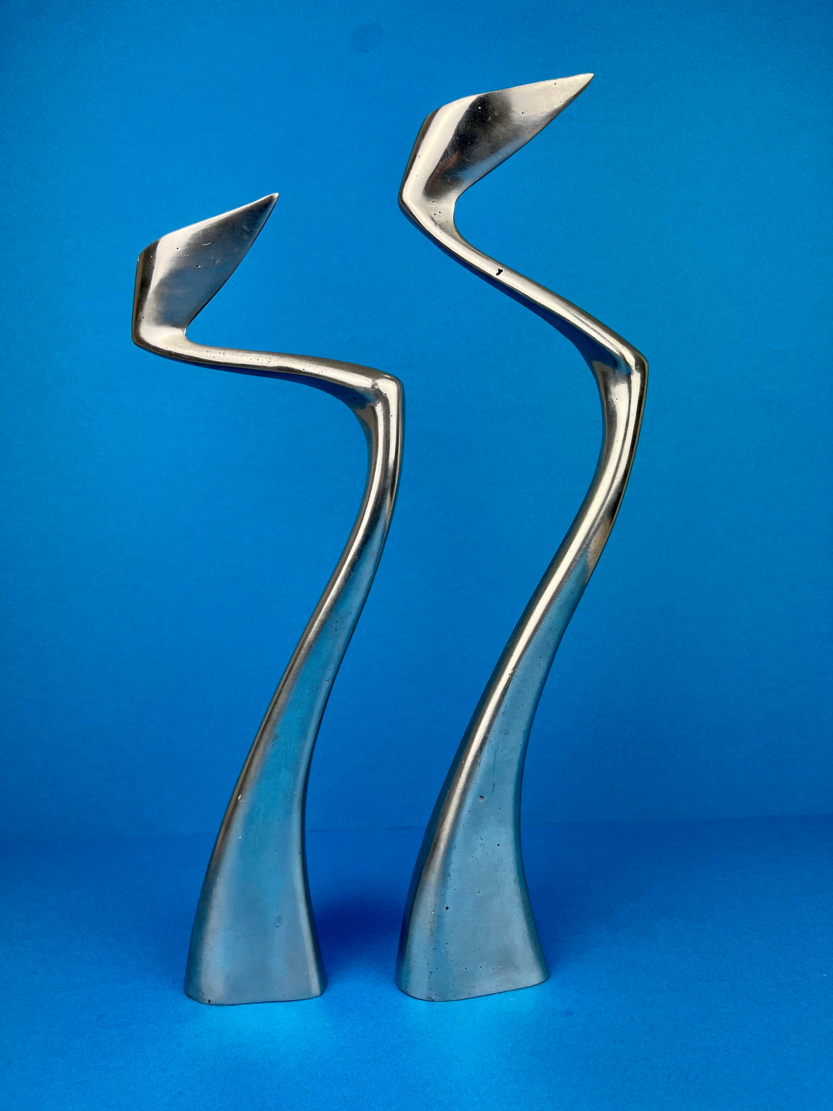 PAIR OF MATTHEW HILTON 'SWAN' CANDLE HOLDERS
