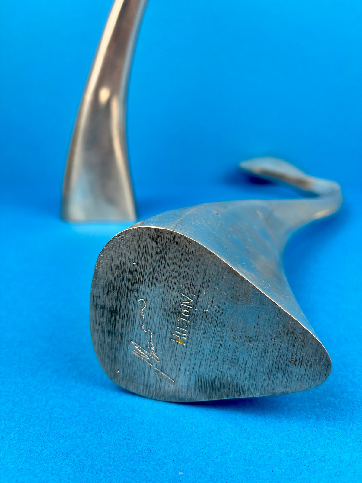 PAIR OF MATTHEW HILTON 'SWAN' CANDLE HOLDERS