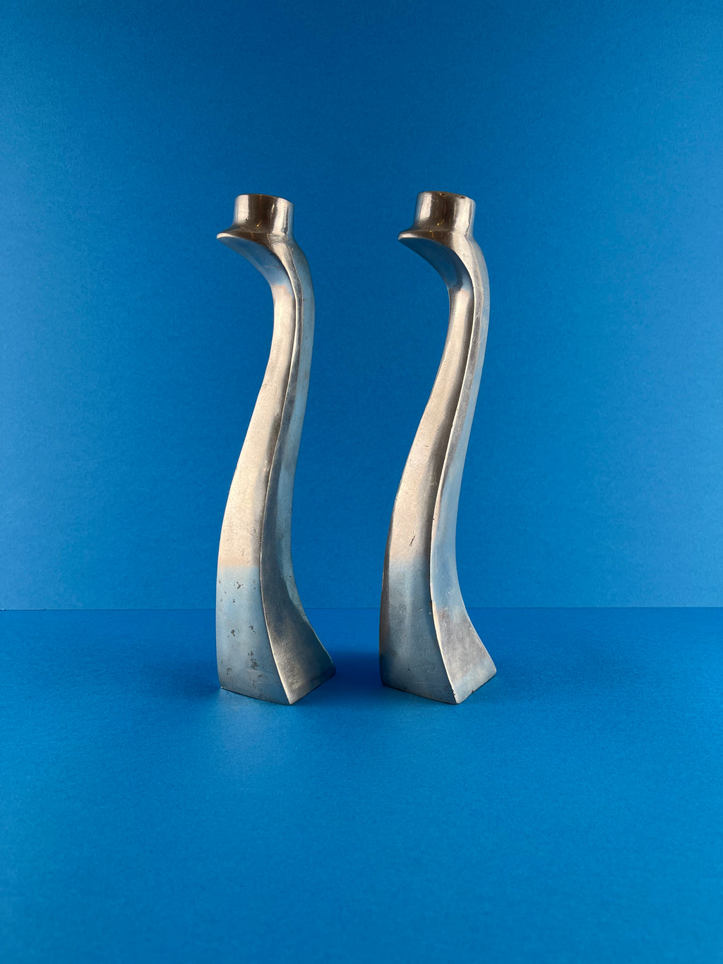 PAIR OF ALUMINIUM CANDLE HOLDERS