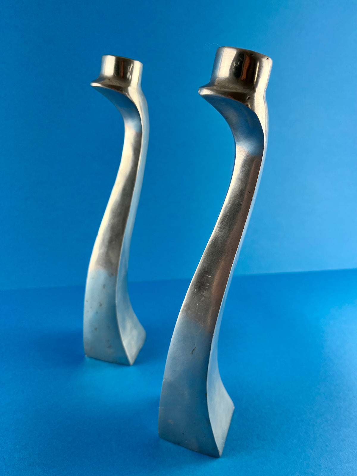 PAIR OF ALUMINIUM CANDLE HOLDERS
