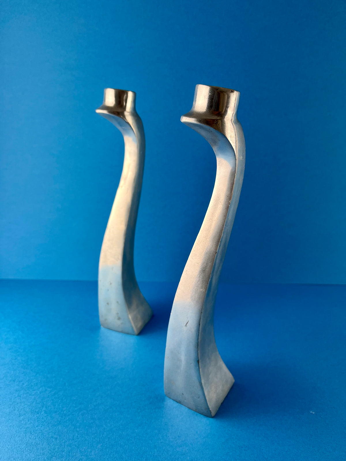 PAIR OF ALUMINIUM CANDLE HOLDERS