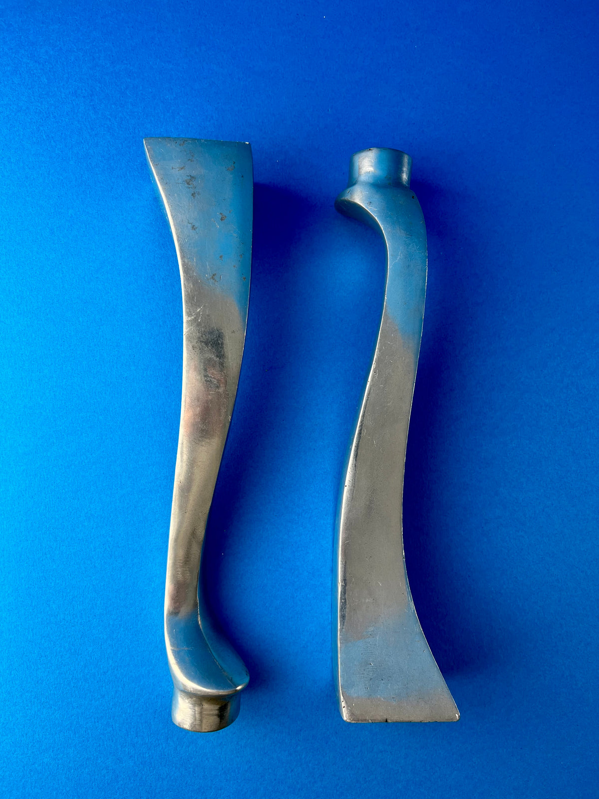 PAIR OF ALUMINIUM CANDLE HOLDERS