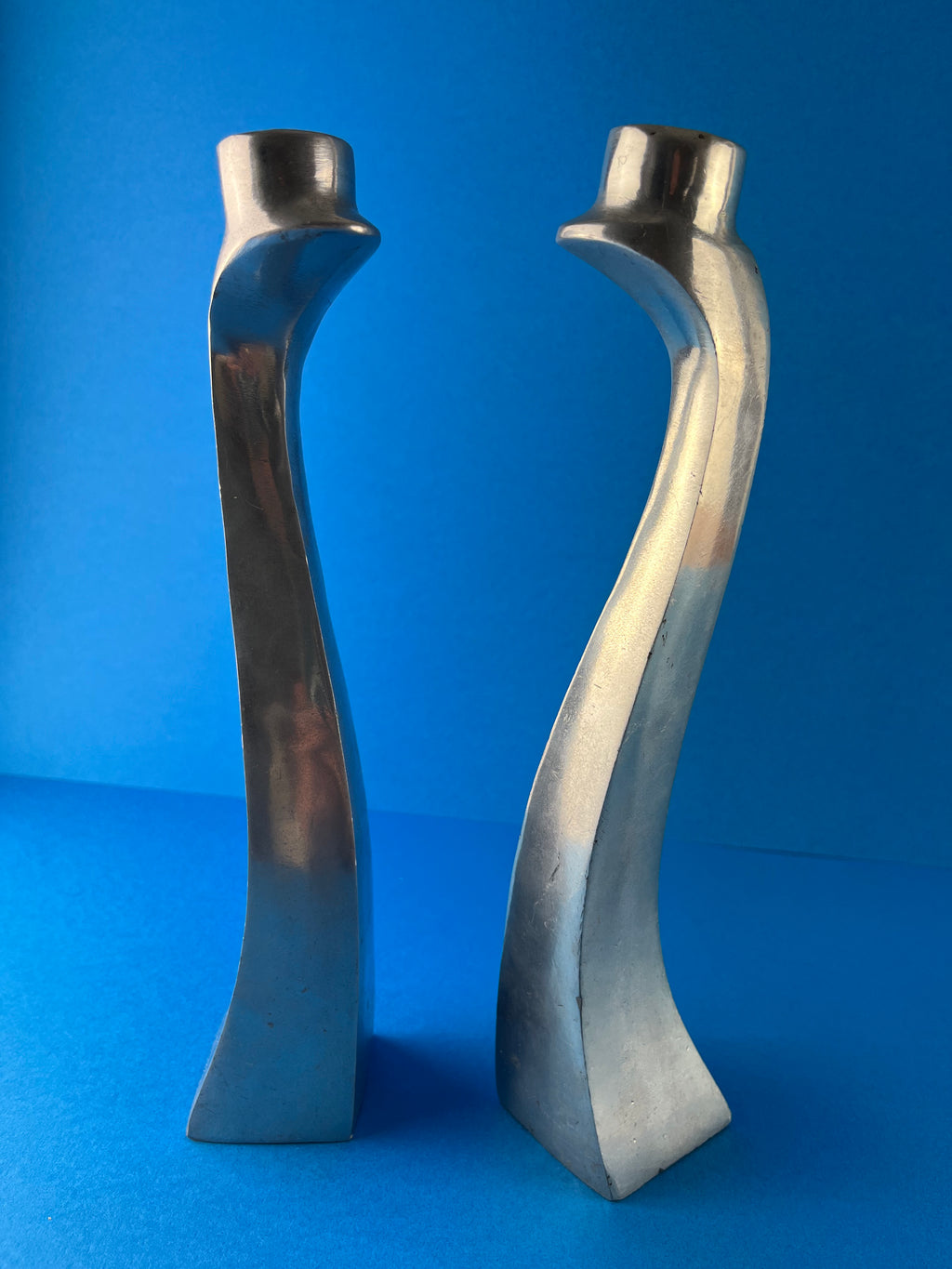 PAIR OF ALUMINIUM CANDLE HOLDERS