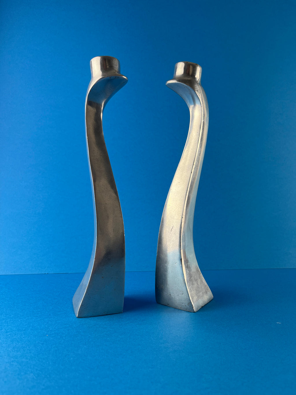 PAIR OF ALUMINIUM CANDLE HOLDERS
