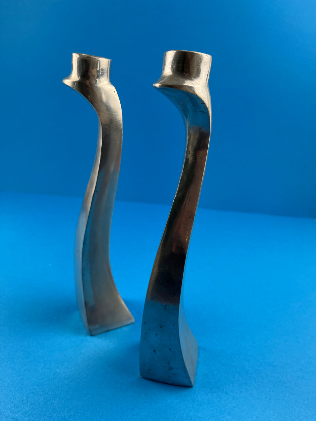 PAIR OF ALUMINIUM CANDLE HOLDERS