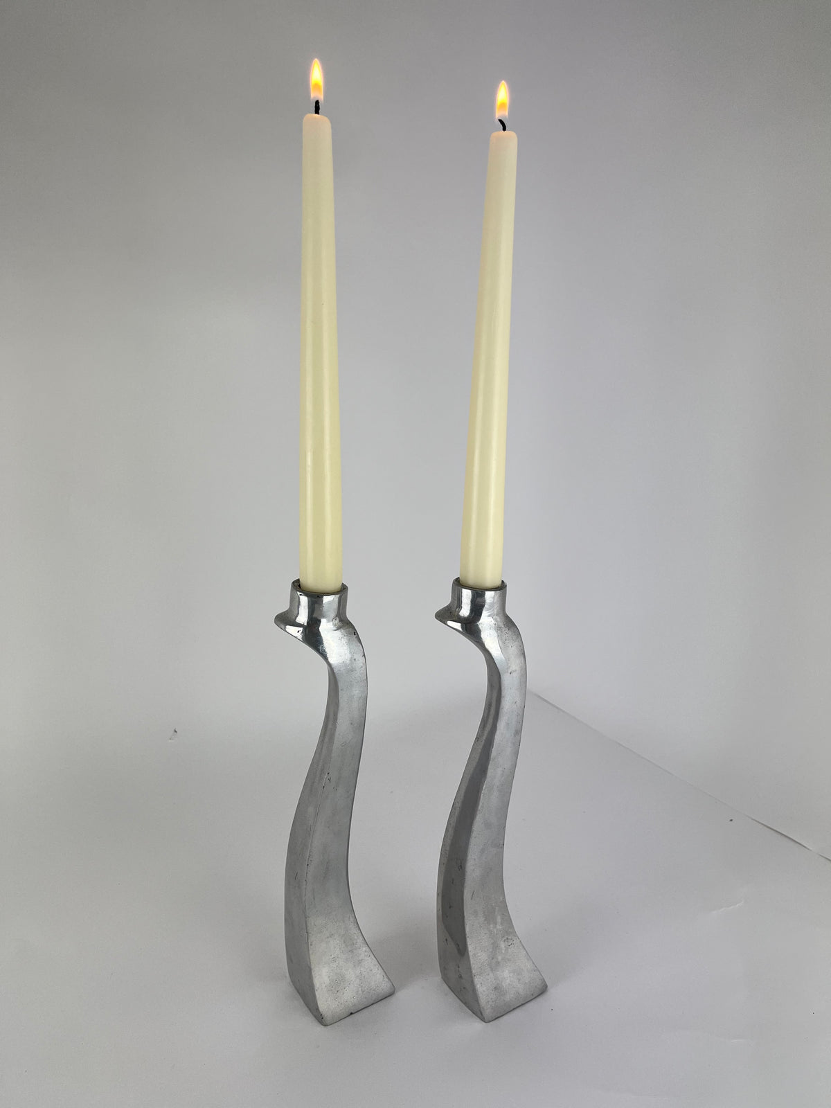 PAIR OF ALUMINIUM CANDLE HOLDERS