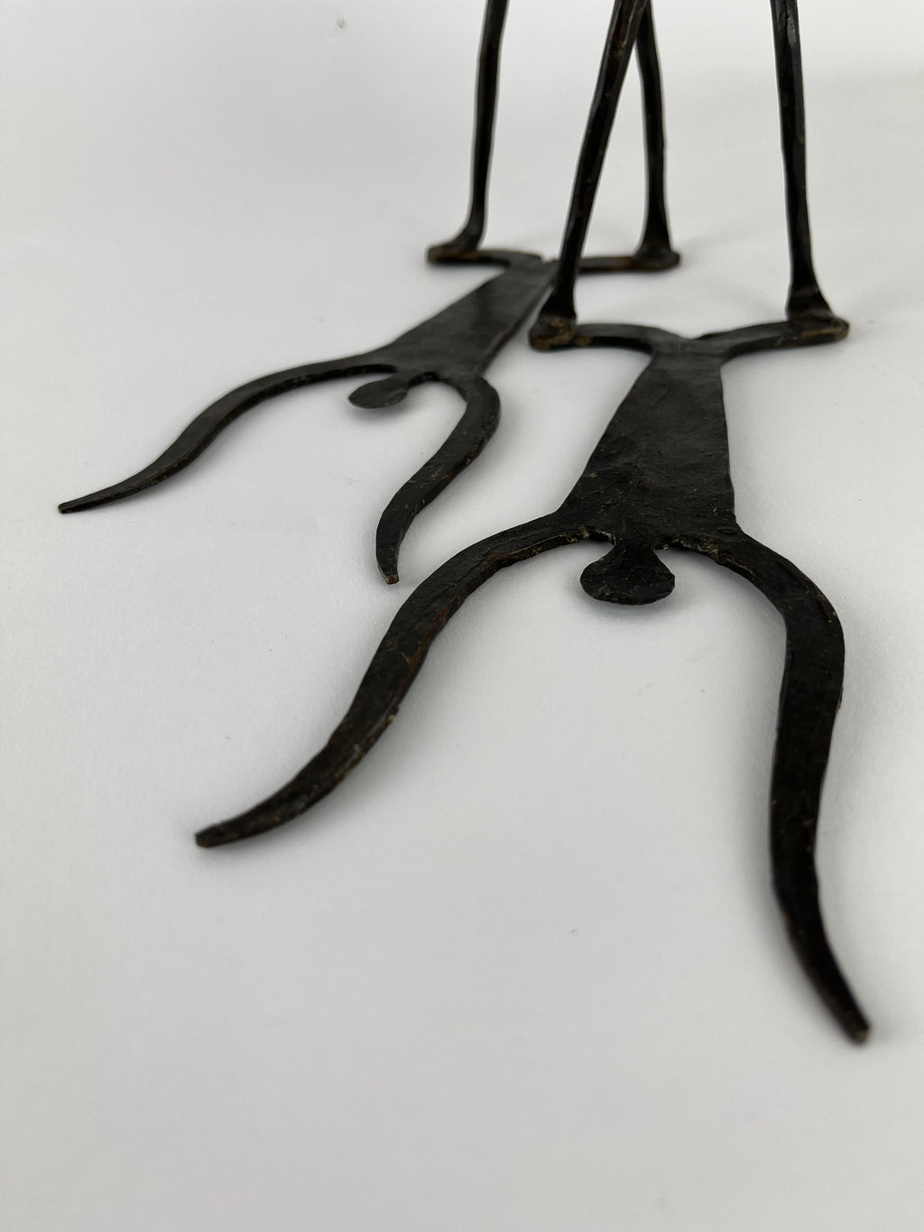 WROUGHT IRON DOGON FIGURAL BOOKENDS