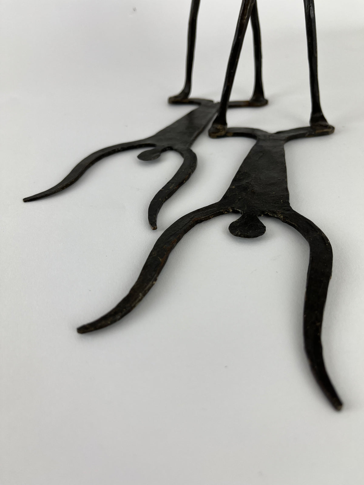 WROUGHT IRON DOGON FIGURAL BOOKENDS