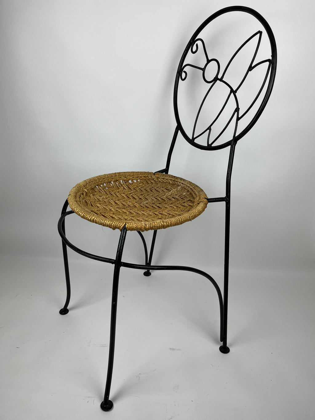 A PAIR OF WROUGHT IRON 'BUTTERFLY' DESIGN CHAIRS