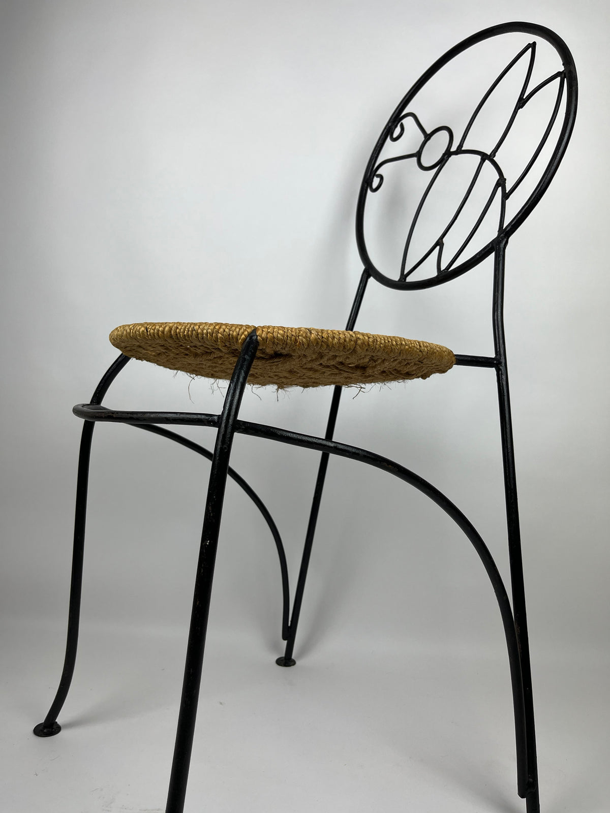 A PAIR OF WROUGHT IRON 'BUTTERFLY' DESIGN CHAIRS